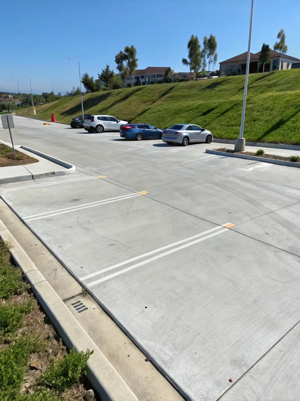 An image of a clean, well-maintained concrete parking area in a commercial property, emphasizing the importance of regular cleaning for property value and safety.